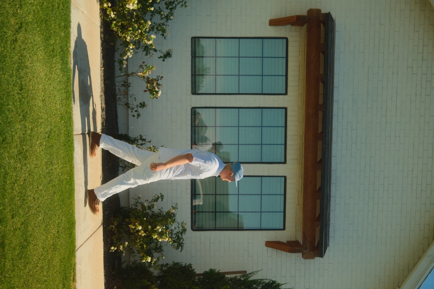 Kova Pest Control technician walking the exterior of an East Valley home
